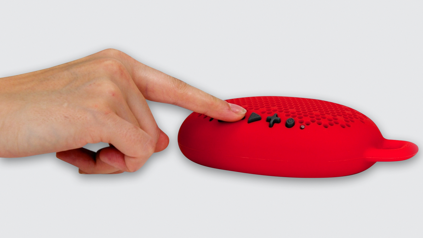 person engaging with Boom Urchin portable bluetooth speaker